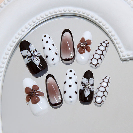 Elegant Floral Elegance Long Almond Shaped Black and White with Unique Flower Accents Nail Set