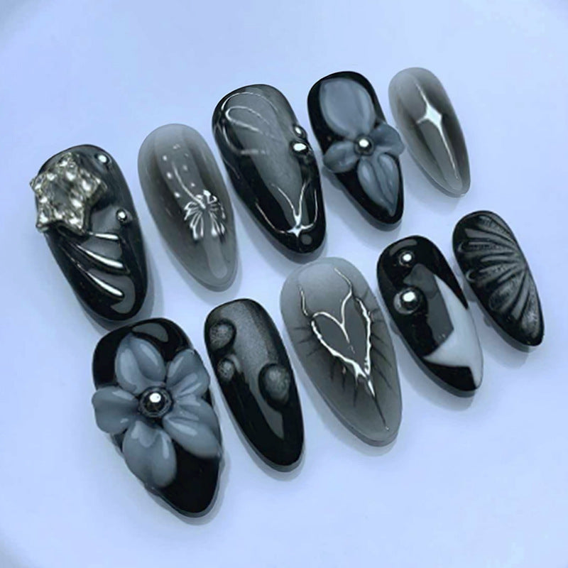 Elegant Noir Medium Almond Black Nail Set with Unique Floral and Gemstone Accents