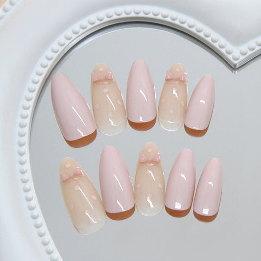 Delicate Charm Medium Almond Pink Nails with Sweet Bow Accent