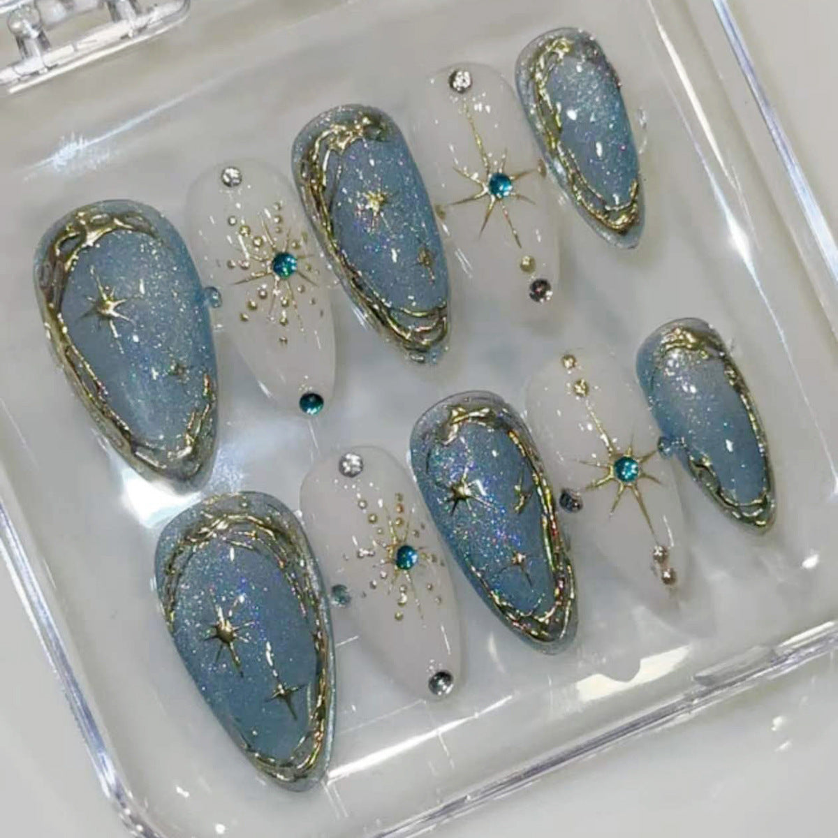 Celestial Charm Medium Almond Light Blue with Glittering Star Accents Nail Set