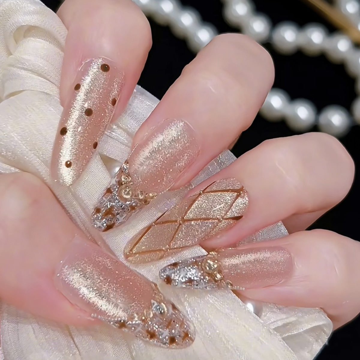 Glimmering Elegance Medium Almond Beige Press on Nail Set with Captivating Metallic Accents