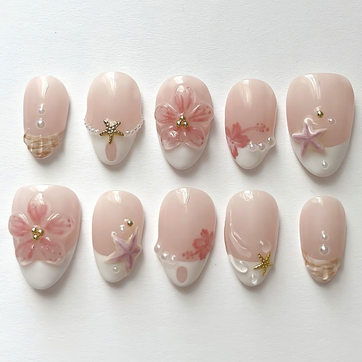 Beachy Vibes Medium Almond Pink Nail Set with Floral Accents and Pearl Details