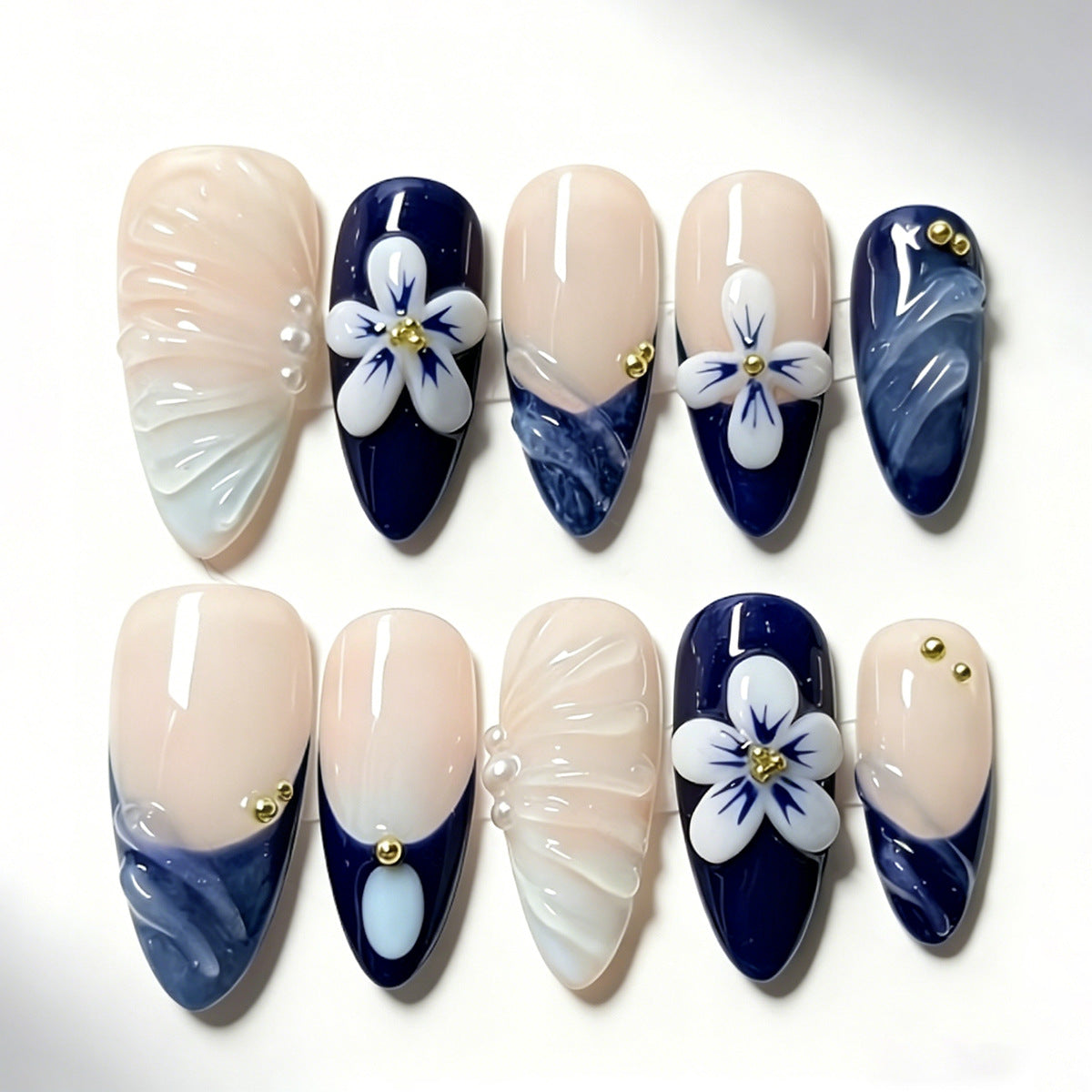 Elegant Floral Dream Medium Almond Navy Blue and Cream Nail Set with Unique Textured Accents