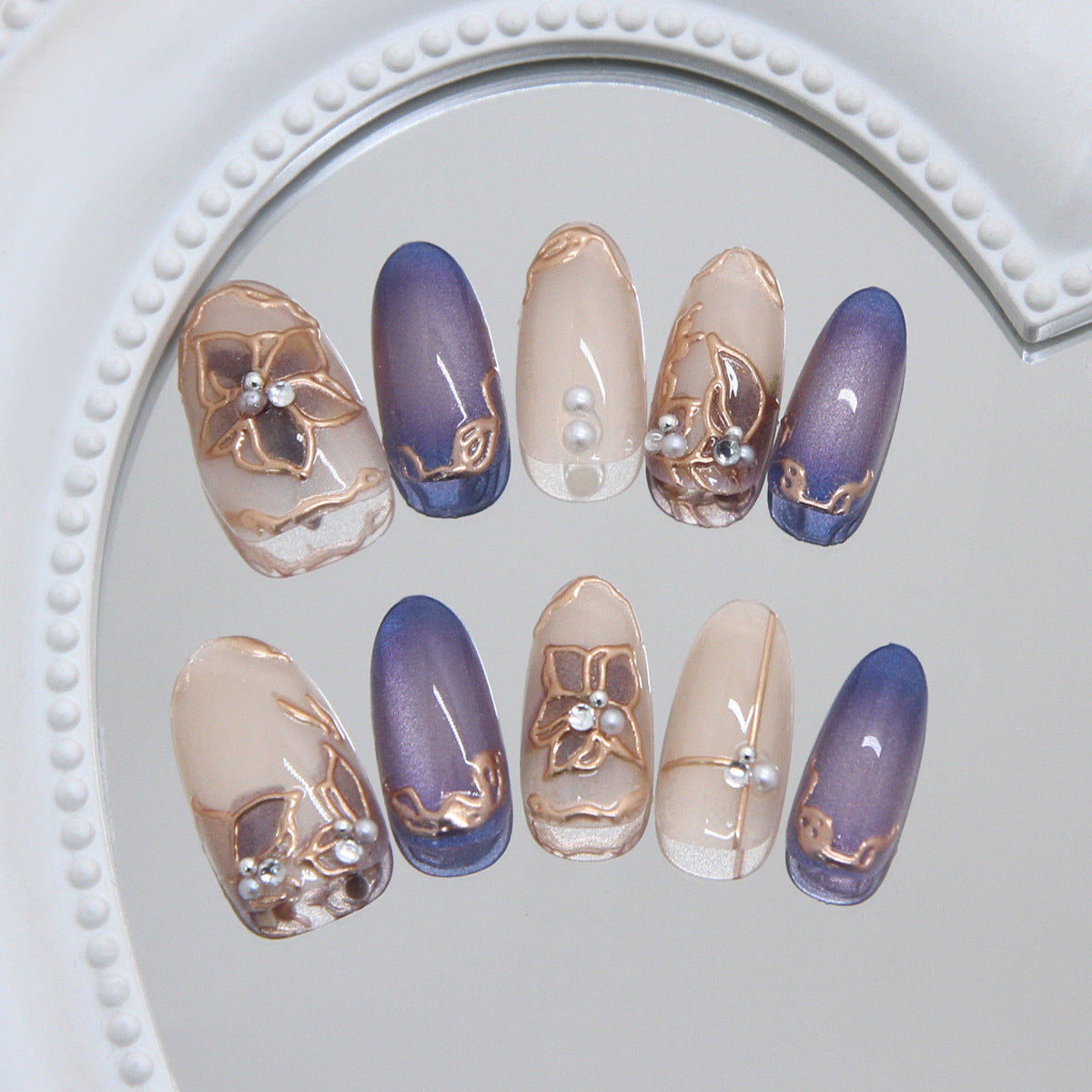 Floral Elegance Long Oval Blue Ombre Nail Set with Artistic Detailing