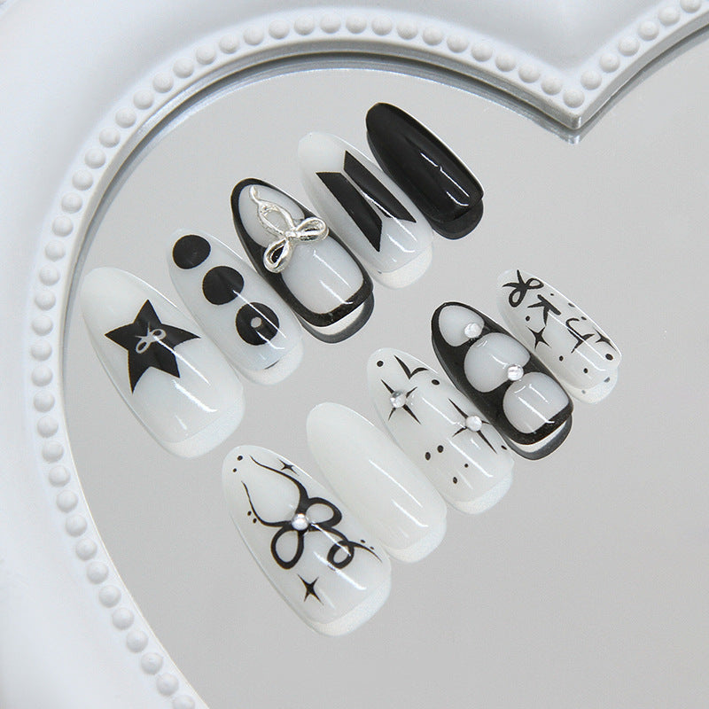 Gothic Elegance Medium Almond White and Black Press on Nail Set with Unique Artistic Designs