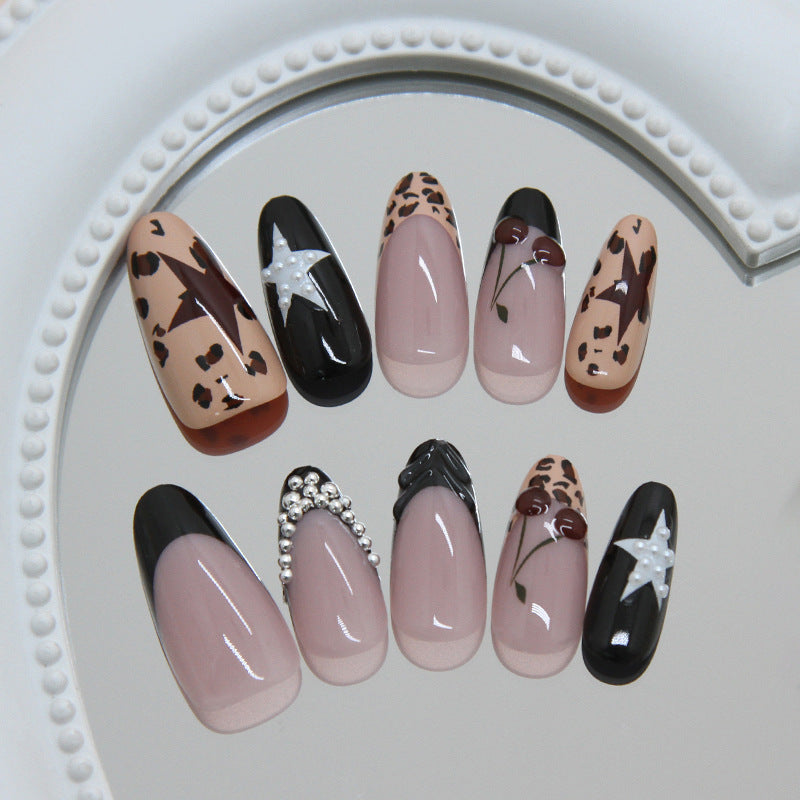 Wild Safari Elegance Long Almond Beige and Black Animal Print Nail Set with Unique Gem Accents