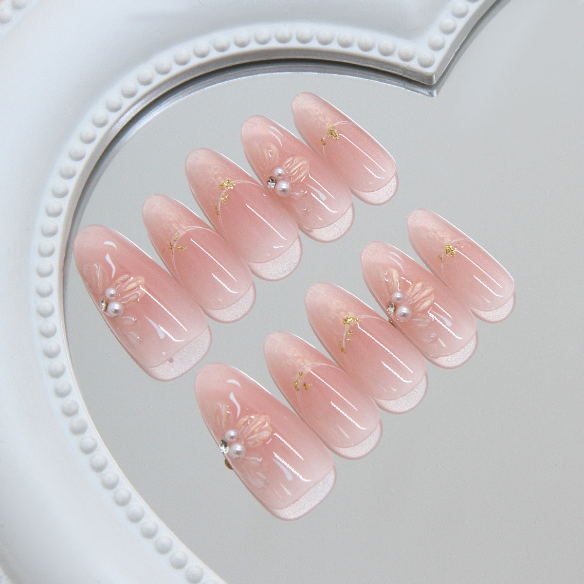 Elegant Floral Charm Long Almond Pink Nails with Delicate Pearl and Gold Accents