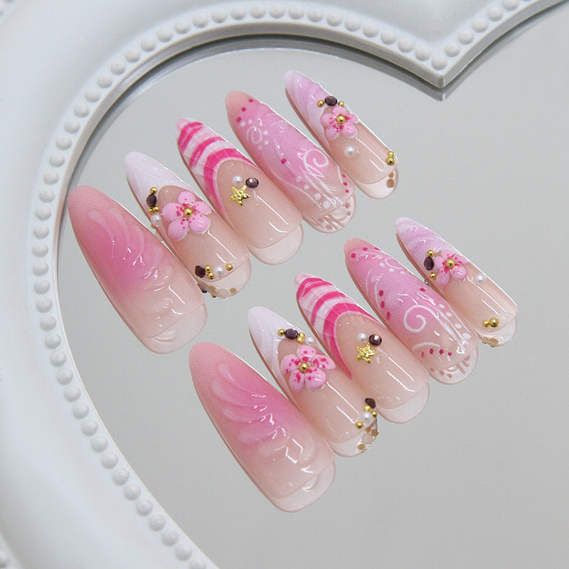 Whimsical Pink Long Almond Press on Nails with Floral Accents and Ombre Finish