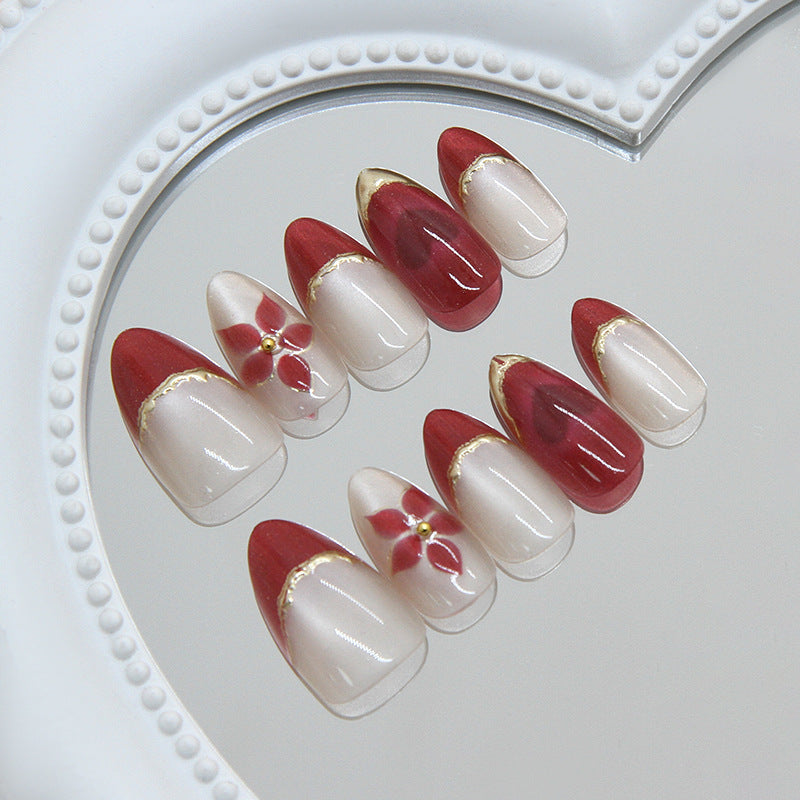 Blossoming Elegance Medium Almond Red and White Floral Nail Set with Gold Accents