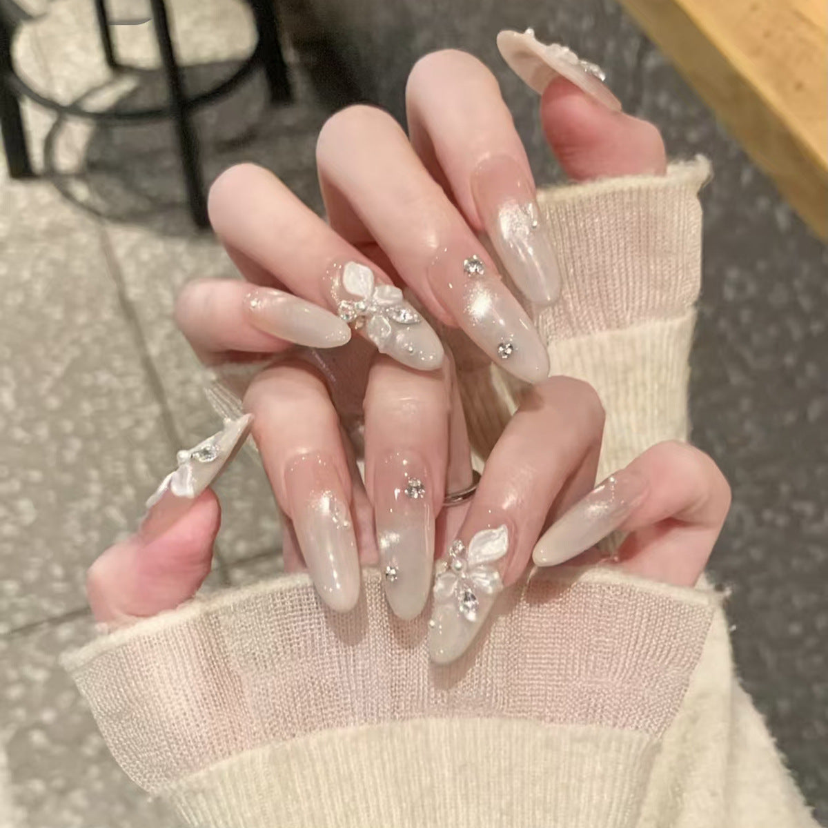 Whimsical Dreamy Long Almond Clear Nails with Floral Embellishments