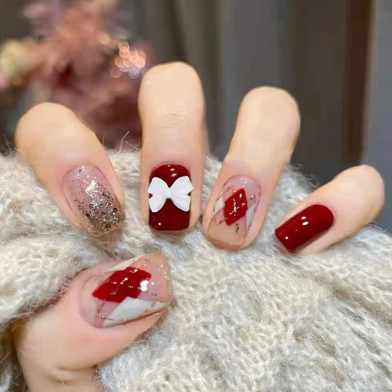 Winter Elegance Short Round Burgundy and Glitter Press On Nails with White Bow Accent