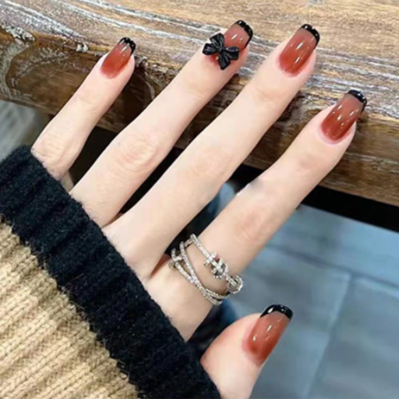 Elegant Gothic Short Round Brown Press On Nails with Black Accents and Bow Detail