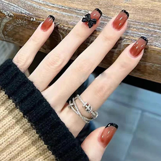 Elegant Gothic Short Round Brown Press On Nails with Black Accents and Bow Detail