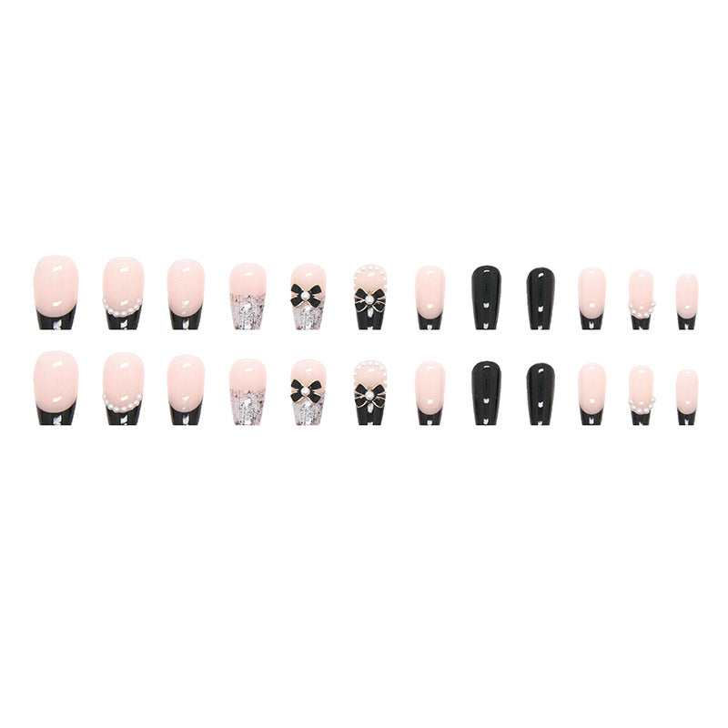 Set of nail art designs with pink, black, and decorative elements on a white background