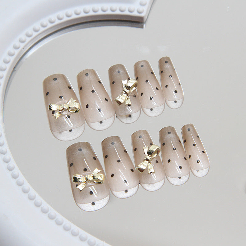 Elegant Soiree Medium Coffin Beige Press On Nail Set with Gold Bow Accents and Sparkling Rhinestones