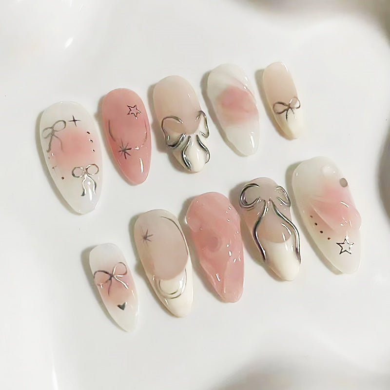 Elegant Romance Medium Almond Peach Pink Press On Nails with Marble Accents and Subtle Embellishments
