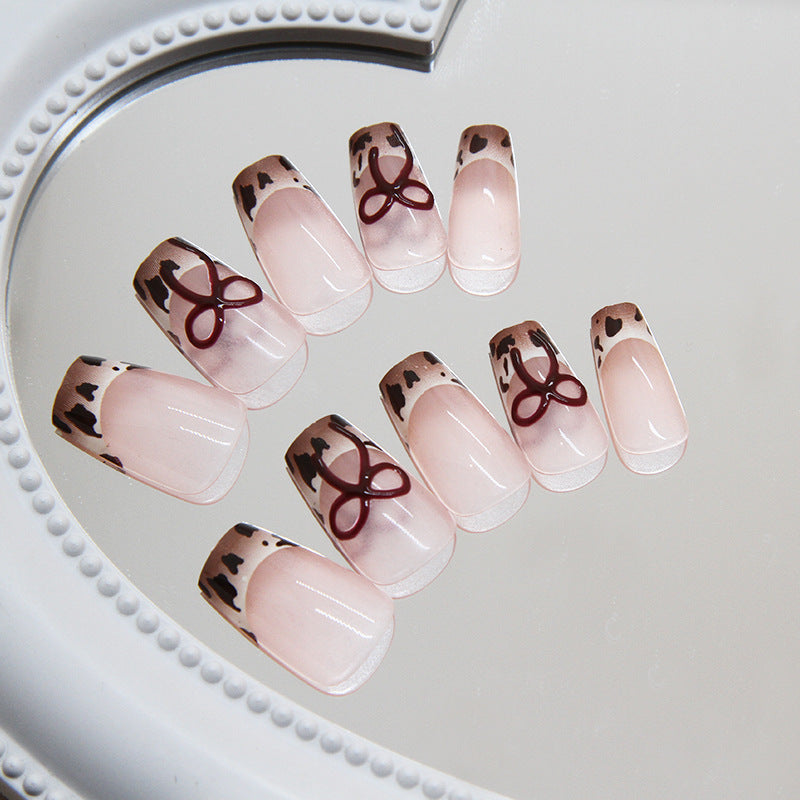 Chic Safari Adventure Medium Coffin Tip Press On Nails in Beige with Animal Print Accents and Bow Feature