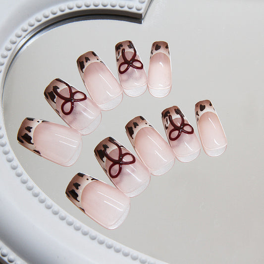 Chic Safari Adventure Medium Coffin Tip Press On Nails in Beige with Animal Print Accents and Bow Feature