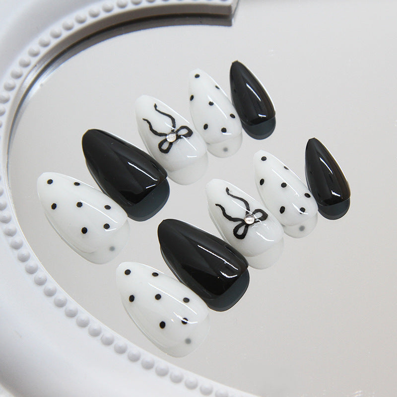Chic Monochrome Elegance Medium Almond Press On Nail Set Black and White with Polka Dots and Bow Design