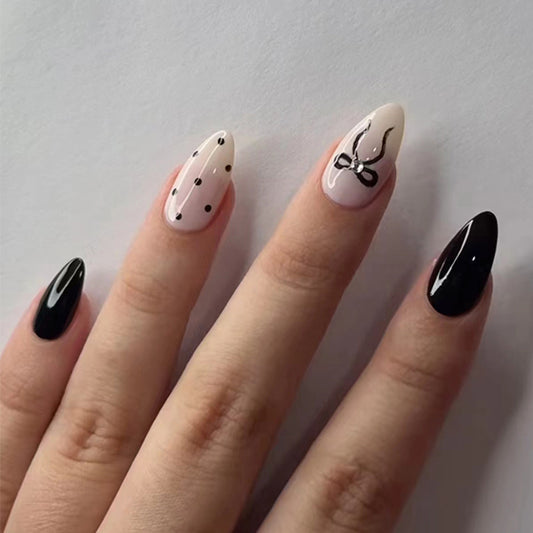 Chic Elegance Medium Almond Black and Beige Press On Nail Set with Dotted and Bow Accent Design