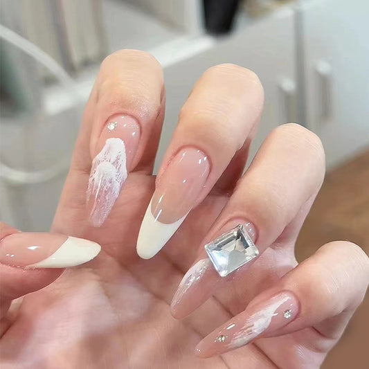 Elegant Winter Wonderland Long Stiletto Press On Nail Set in Soft Pink and White with Dazzling Rhinestone Accent
