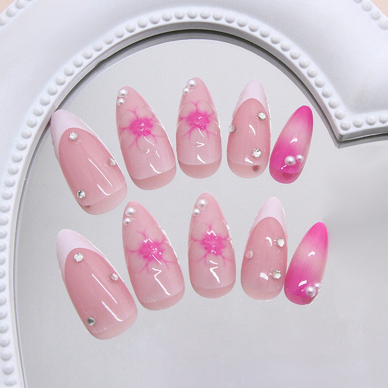 Blossom Dream Long Almond Pink Nails with Glittering Accents and Floral Design