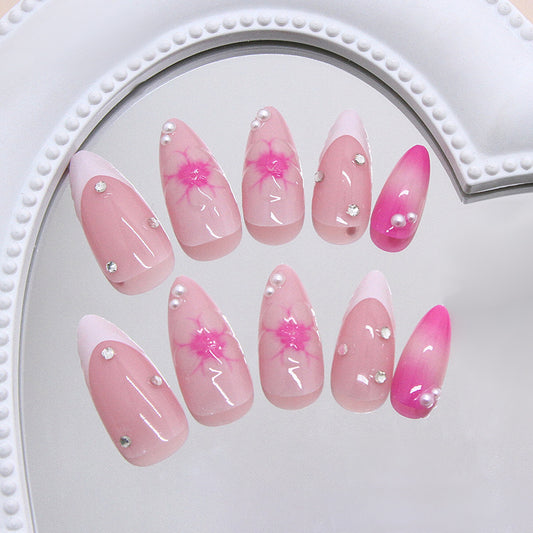 Blossom Dream Long Almond Pink Nails with Glittering Accents and Floral Design