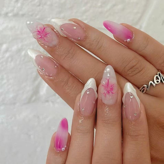 Blossoming Elegance Long Almond Pink Ombre Nail Set with Floral Accents and Sparkling Gems
