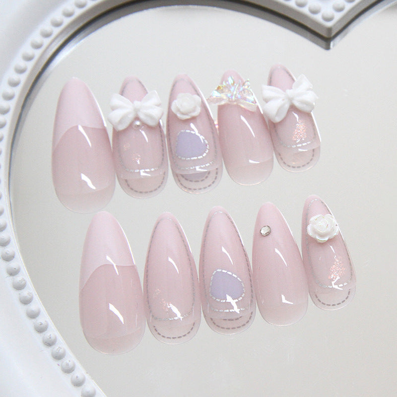 Whimsical Elegance Medium Almond Shaped Soft Pink Nail Set with Adorable Bow and Floral Accents