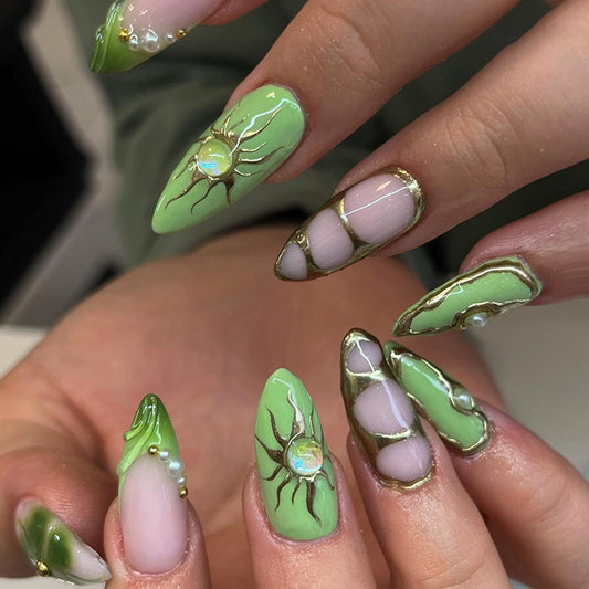 Nature‚Äö√Ñ√¥s Glow Medium Almond Green Press On Nail Set with Elegant Gold Accents and Unique Marble Design