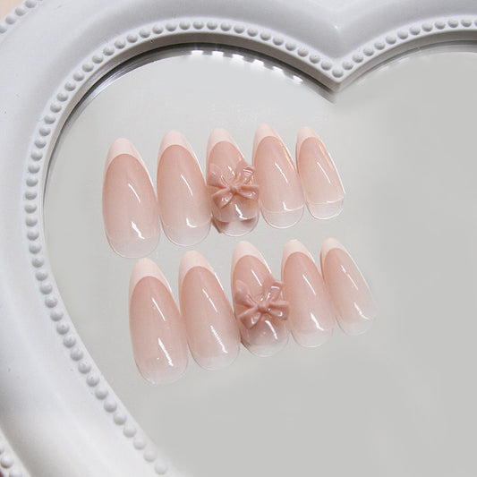 Charming Elegance Medium Almond Shaped Natural Pink Press On Nail Set with Decorative Bow Feature