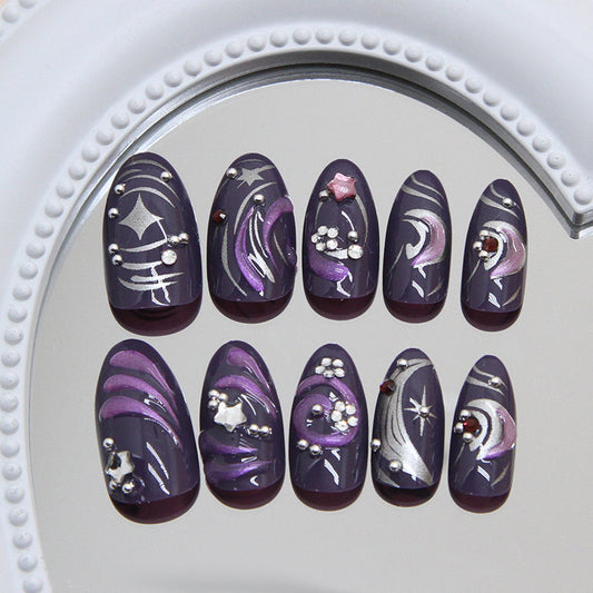 Set of purple and silver nail art designs on a mirror background