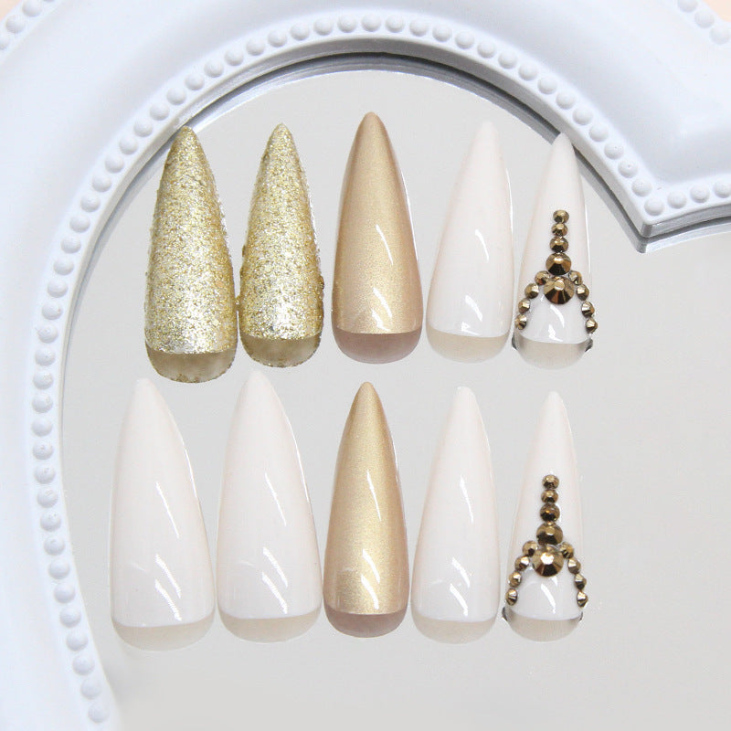 Glamorous Elegance Long Stiletto Shaped White and Gold Press On Nail Set with Glitter and Decorative Accents