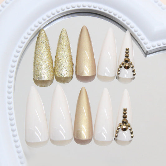Glamorous Elegance Long Stiletto Shaped White and Gold Press On Nail Set with Glitter and Decorative Accents