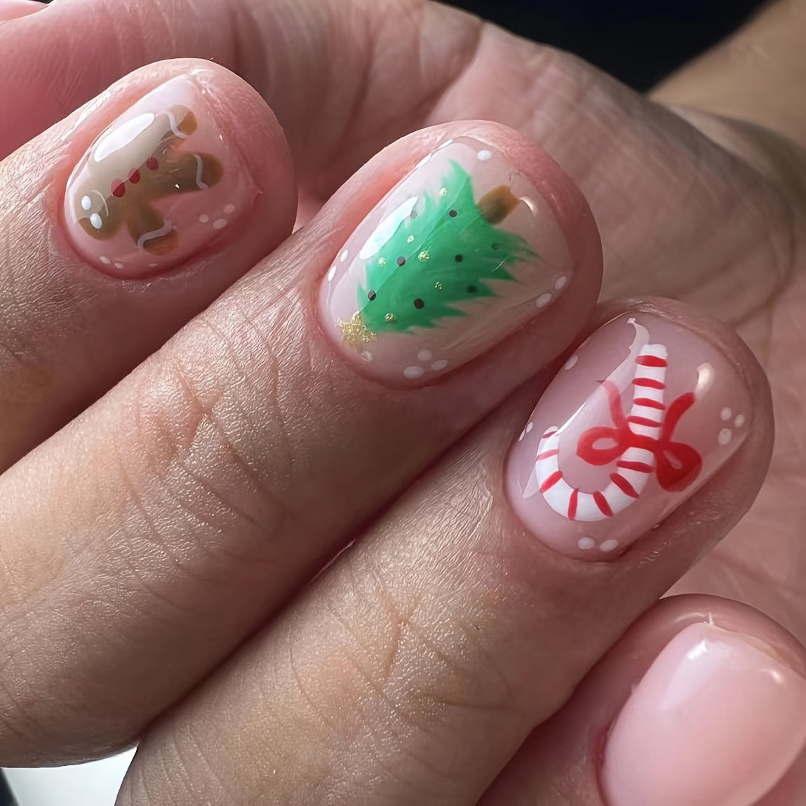Festive Spirit Short Round Natural Pink Press On Nails with Christmas Tree and Candy Cane Accents