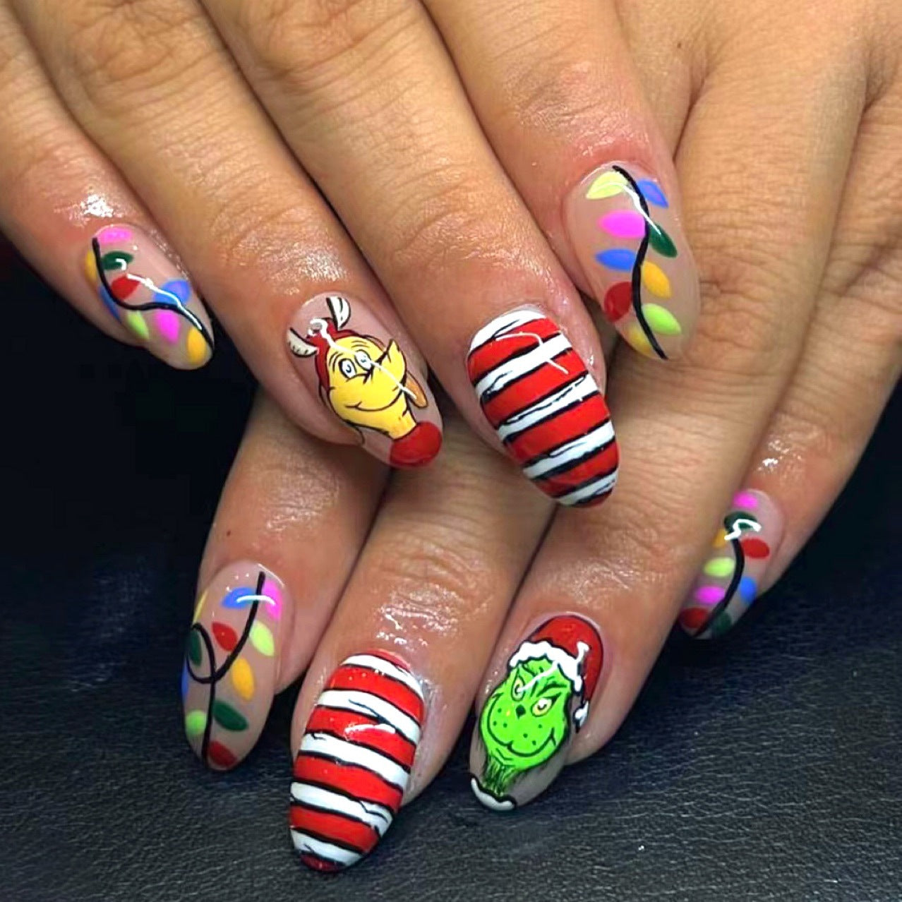 Holiday Mischief Long Oval Multicolor Press On Nail Set With Striped Candy And Festive Lights Design