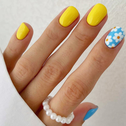 Summer Sunshine Medium Oval Vibrant Yellow Press On Nails with Blue Floral Accent and Sky Blue Feature Nail