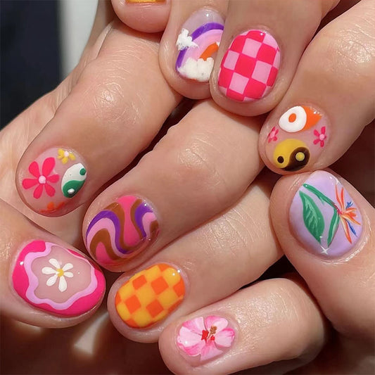 Colorful nail art with various designs on a hand