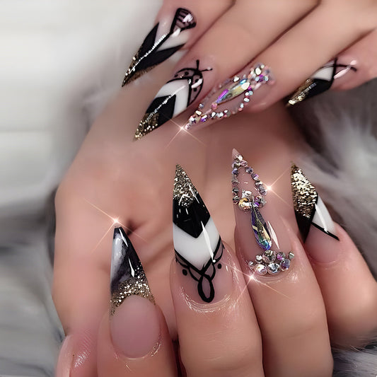 Glamorous Long Stiletto Black and White Press-On Nails with Gold Glitter and Rhinestone Embellishments