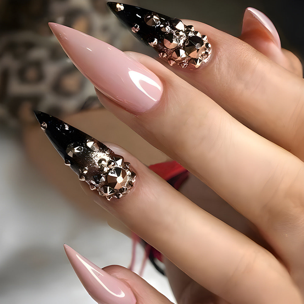 Glamourous Long Stiletto Gradient Nails with Bold Black Tips and Luxe Gemstone Accents