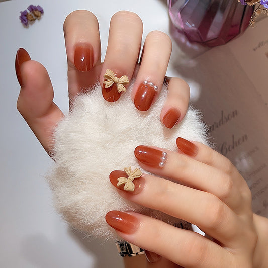 Elegant Autumnal Medium Oval Burnt Orange Press On Nail Set with Bow and Pearl Accents
