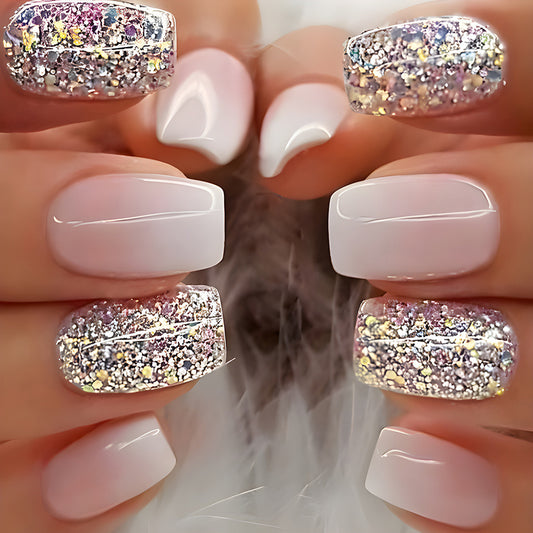 A set of press-on nails featuring a square shape with a glittery pink base and gold stripe detail.