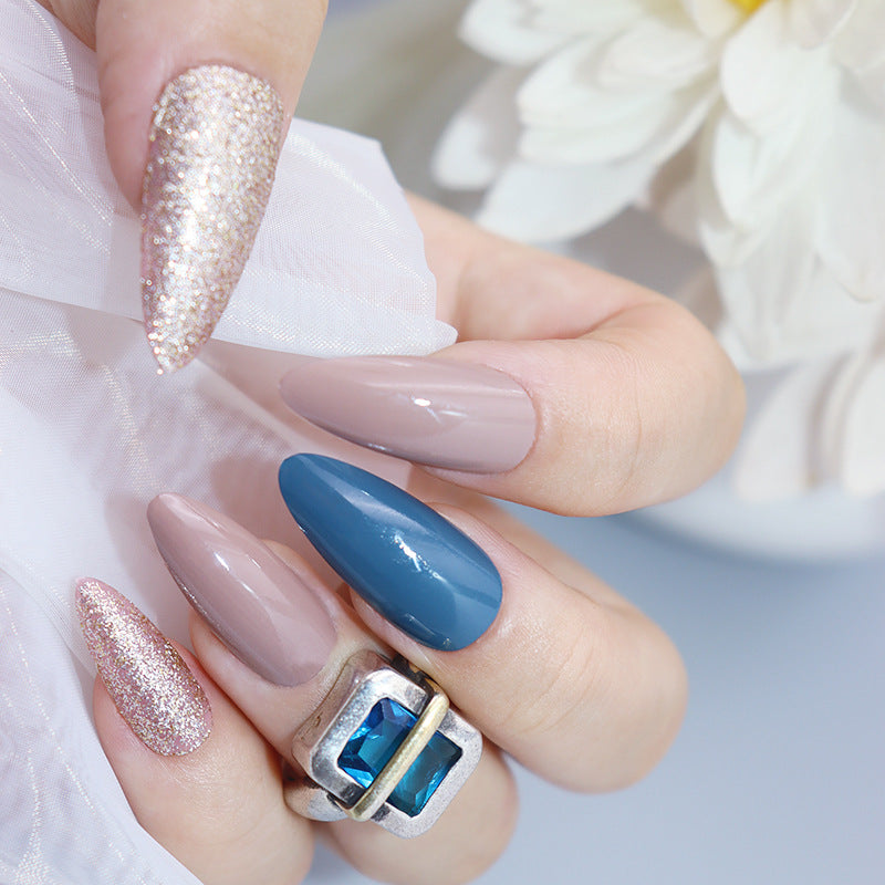 Elegant Soir≈Ωe Long Almond-Shaped Press-On Nail Set in Mauve, Glittery Champagne, and Deep Blue with Gemstone Accent