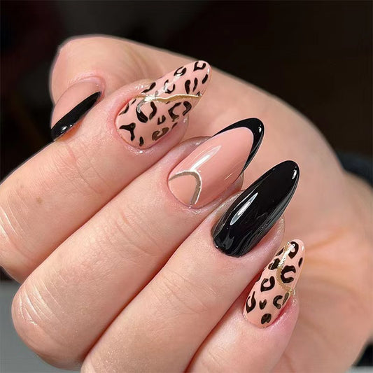 Safari Chic Medium Almond Press-on Nails with Black, Beige, and Leopard Print Design Featuring Gold Accents