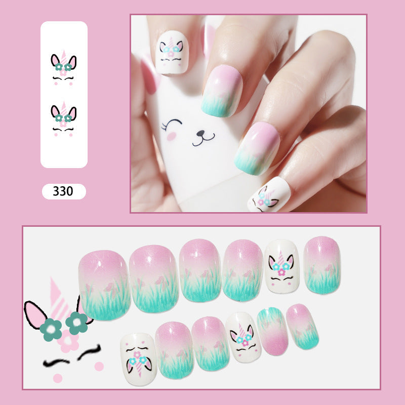 Press-on nails featuring a unicorn and butterfly design in white, pink, green, and blue colors with cute animal faces.