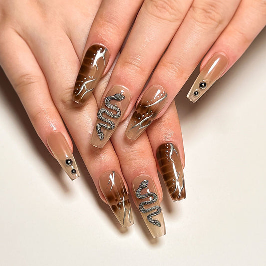 Glamorous Long Coffin Beige Press-On Nails with Shimmering Snake Design and Rhinestone Accents