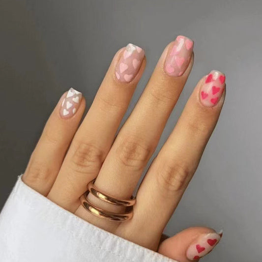 Whimsical Affair Medium Square Blush Pink Press-On Nails with Playful Heart Patterns