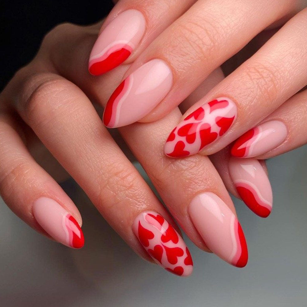 Passionate Embrace Medium Almond Press-On Nails in Beige and Red with Wave Accents and Heart Patterns