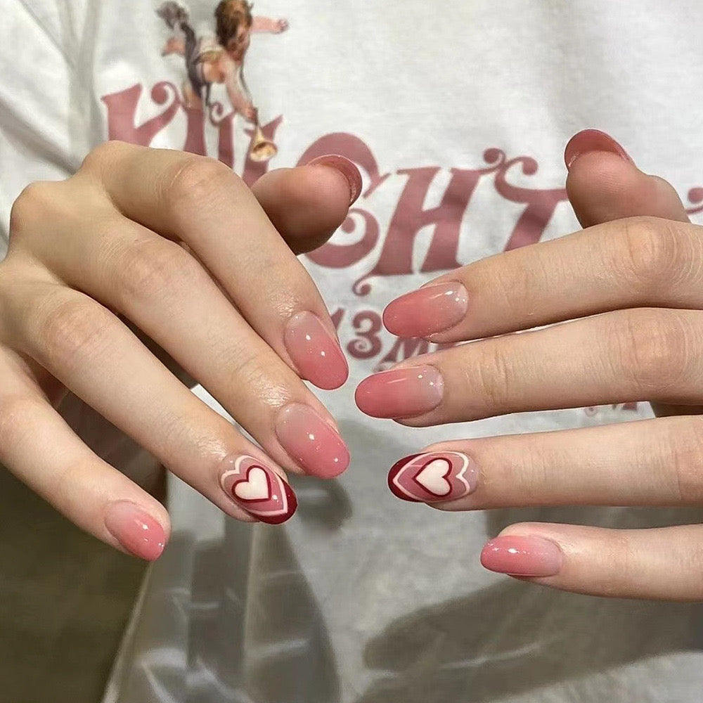 Sweetheart Medium Oval Pink Press-On Nails with Heart Accents and Ombre Design