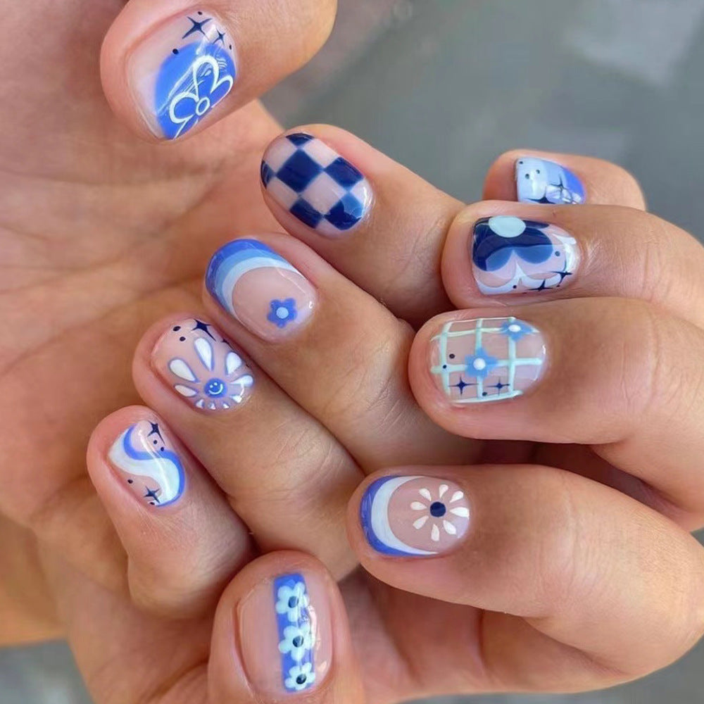 Whimsical Charm Short-Length Squoval Blue and White Designer Press-On Nail Set with Unique Pattern Accents